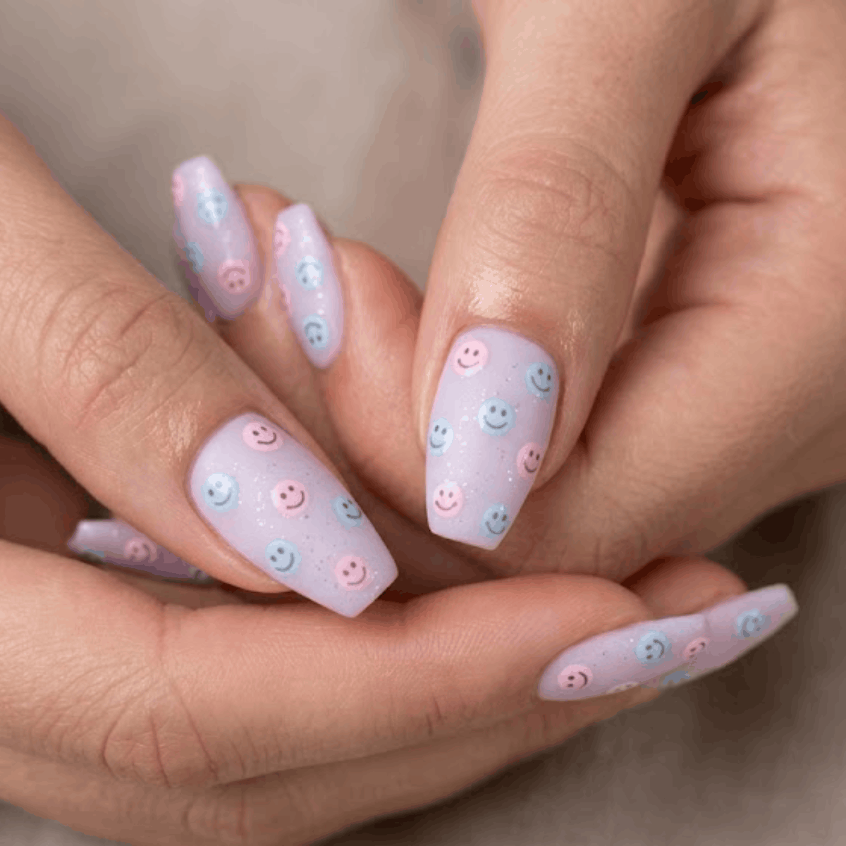 3 Cheerful Pastel Rainbow Nail Sets with Doodled Smiles for Weekend Outings